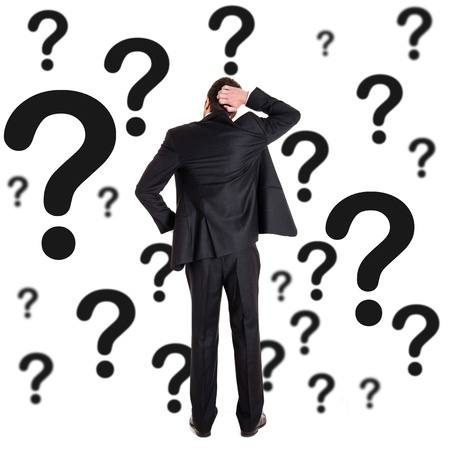 17575544 – thoughtful man surrounded by question marks